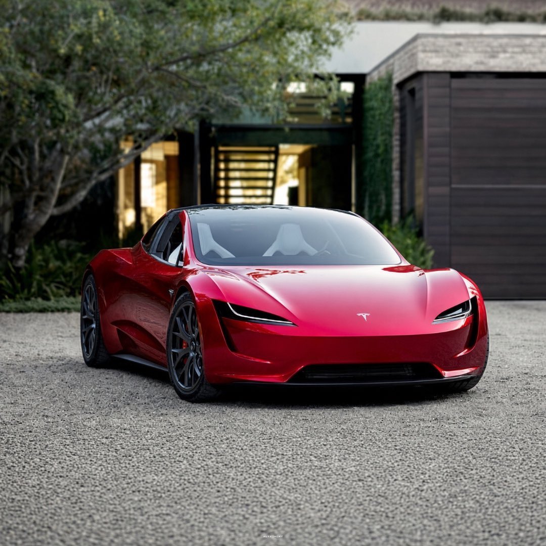 Tesla 第二代 Roadster 紅色車身停在住宅車道上的宣傳圖